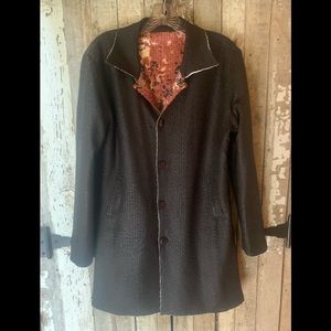 Blacks, browns, copper. Reversible. Size large.